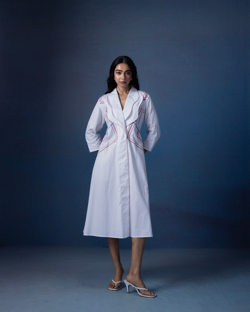 Straight fit one piece dress with curved lapel collar and thread